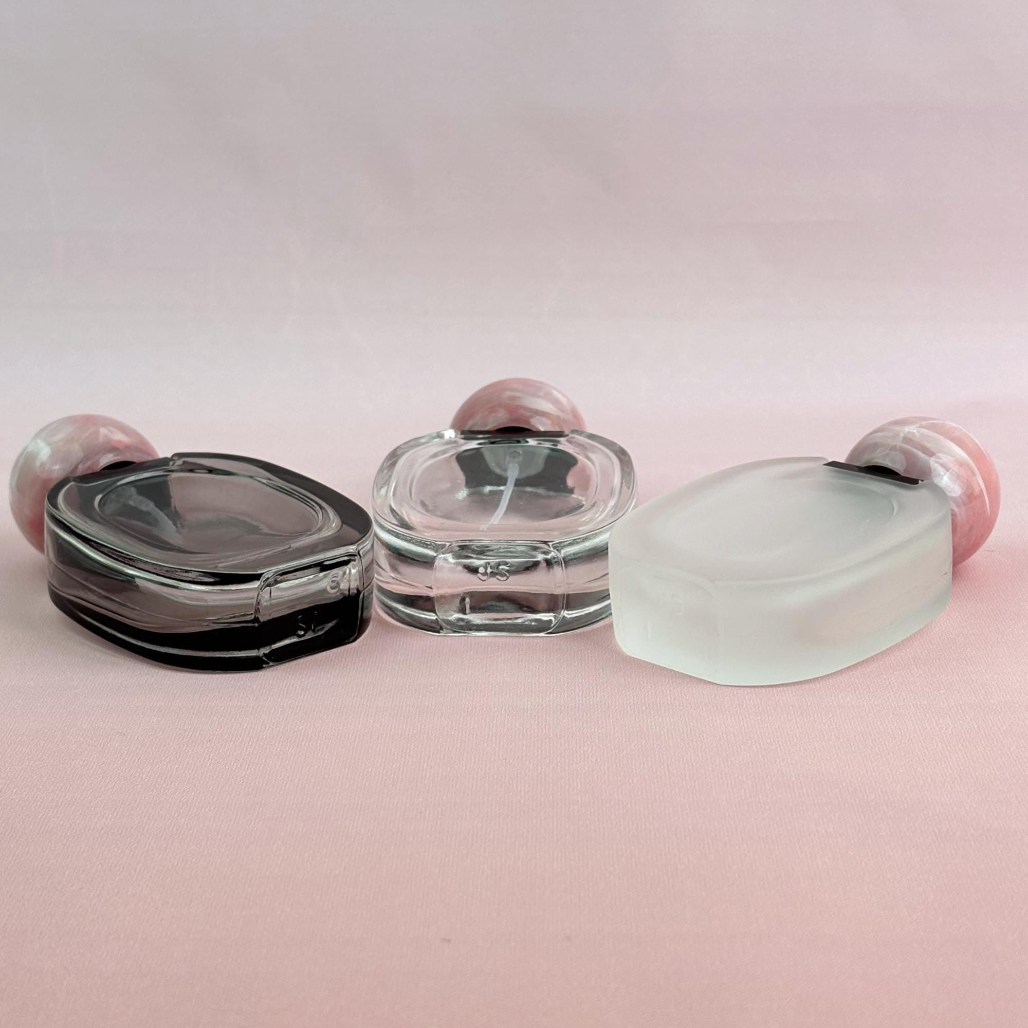 Glass Spray Bottle with Pink plastic Ball Caps