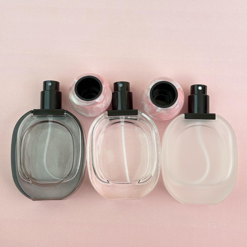 Glass Spray Bottle with Pink plastic Ball Caps