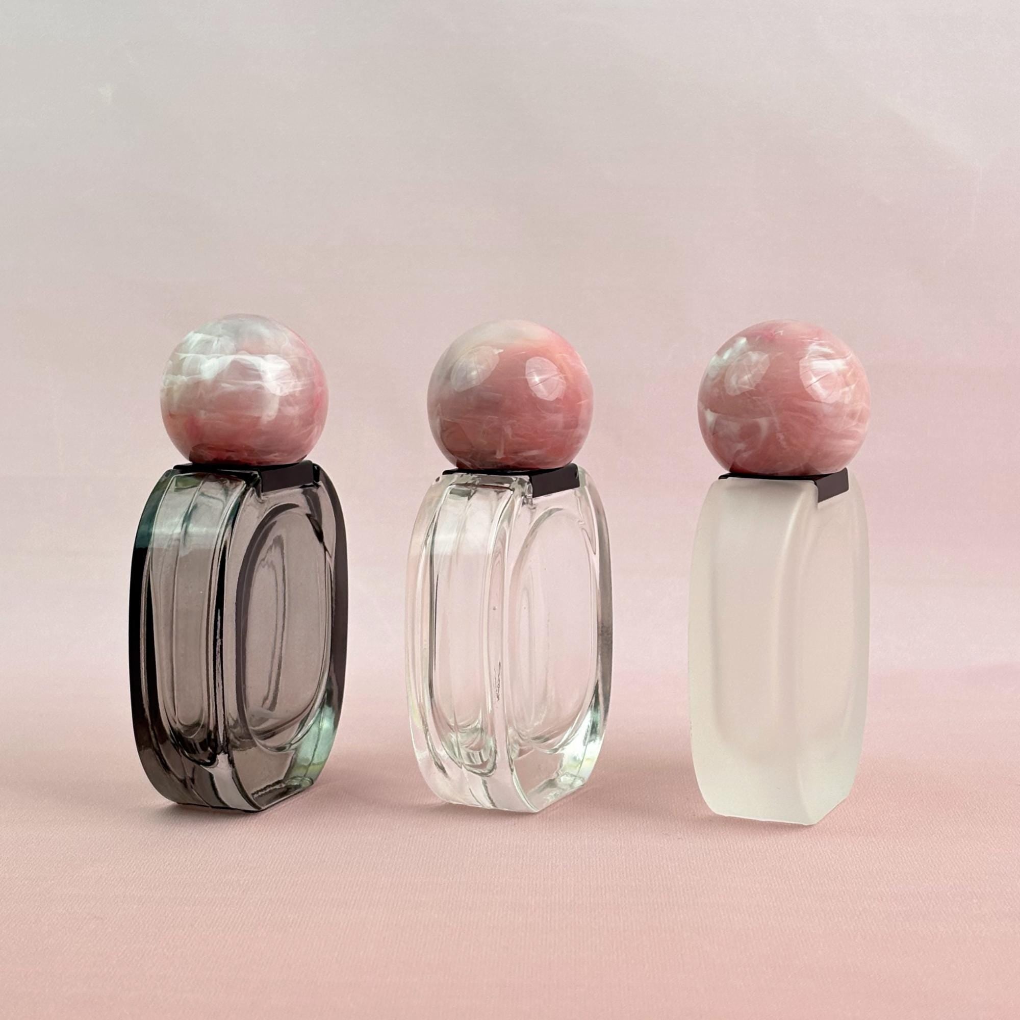 Glass Spray Bottle with Pink plastic Ball Caps