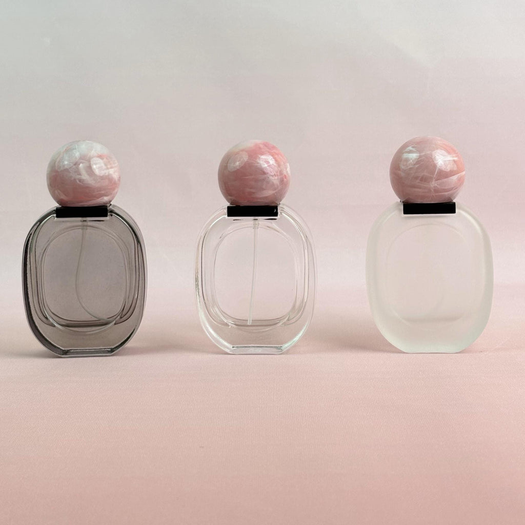 Glass Spray Bottle with Pink plastic Ball Caps