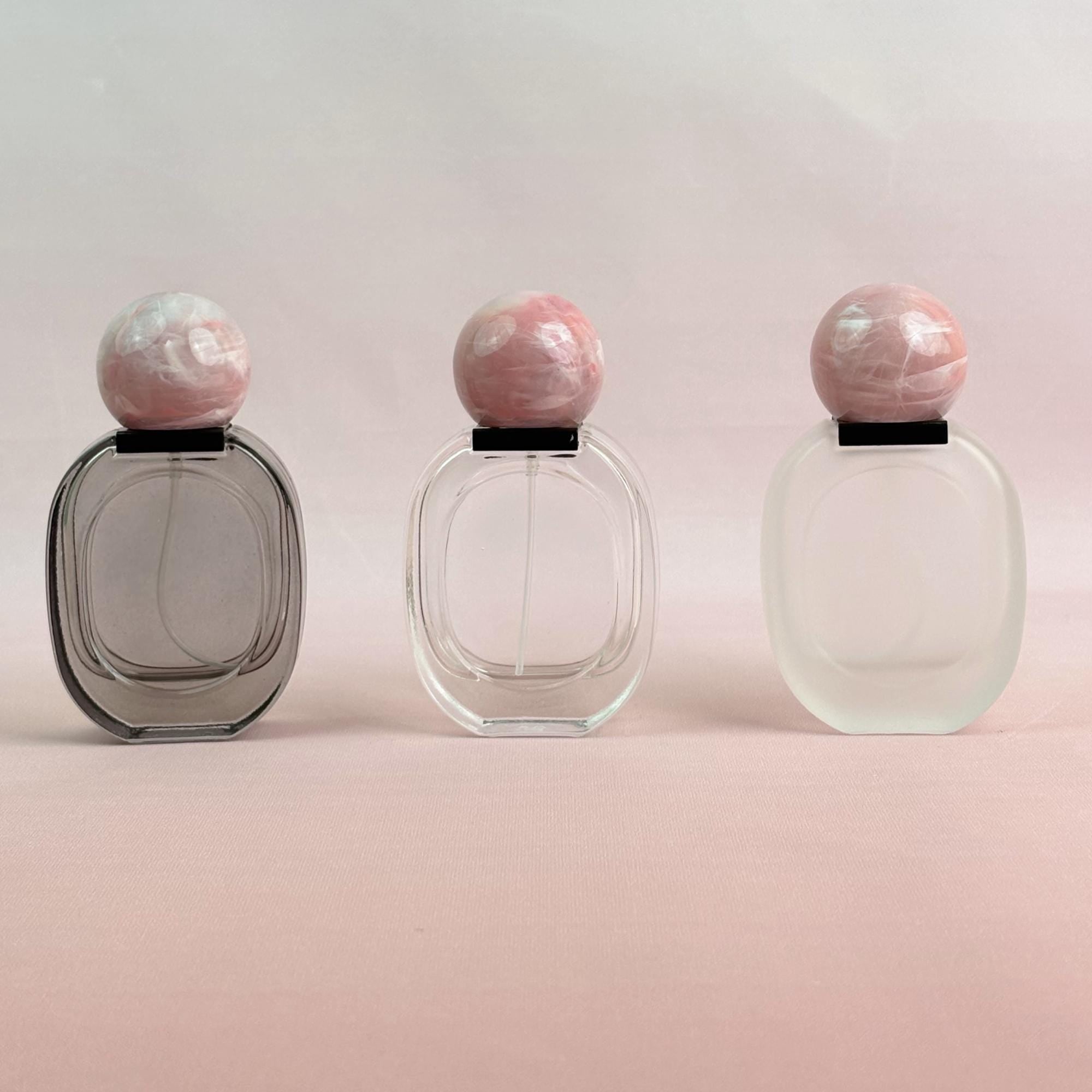 Glass Spray Bottle with Pink plastic Ball Caps