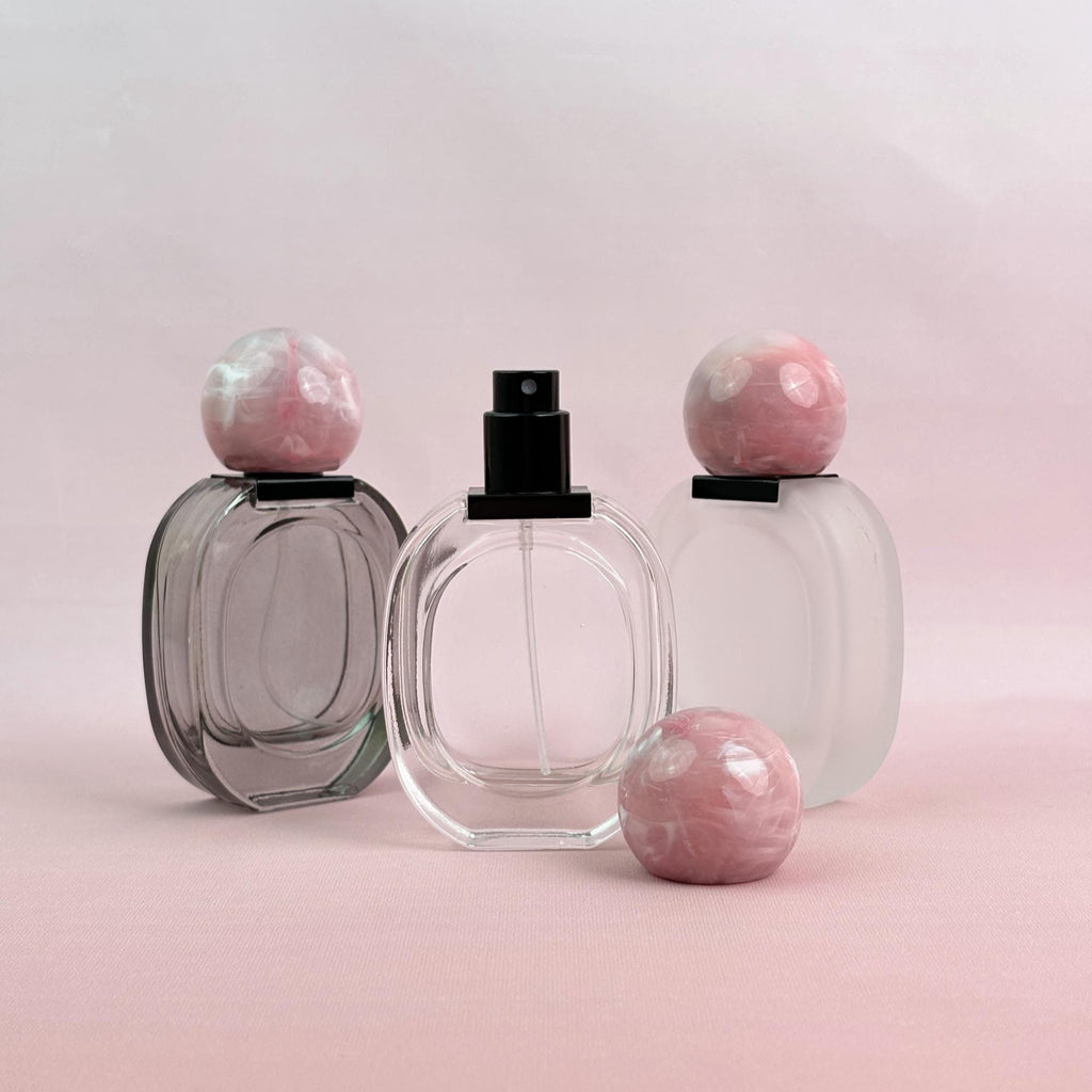 Glass Spray Bottle with Pink plastic Ball Caps