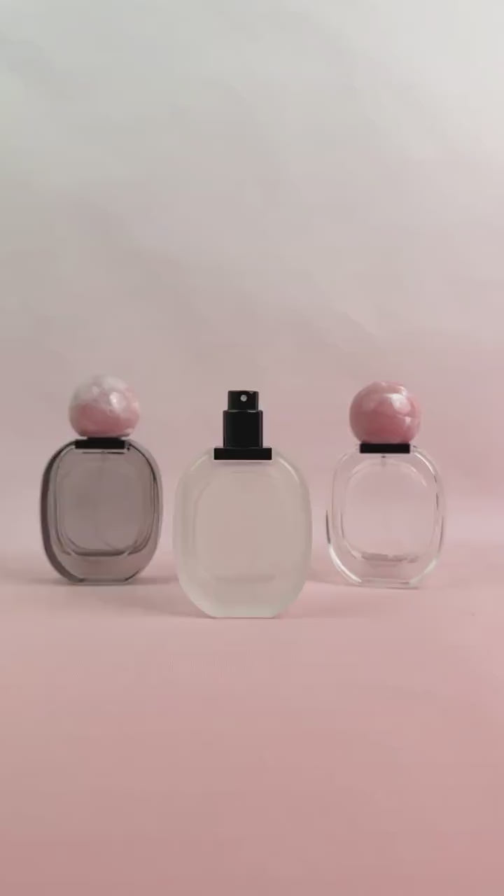 Glass Spray Bottle with Pink plastic Ball Caps